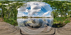 Full seamless spherical hdri panorama 360 degrees angle view on wooden pier among the bushes of forest near river or lake in