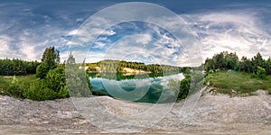 Full seamless spherical hdri panorama 360 degrees angle view on limestone coast of huge green lake or river near forest in summer