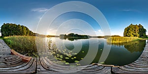 Full seamless spherical hdri panorama 360 degrees angle view on wooden pier near lake in evening in equirectangular projection photo