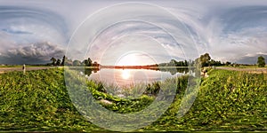 Full seamless spherical panorama 360 by 180 angle view on the shore of lake in evening before storm in equirectangular projection photo