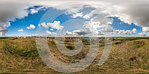 Full seamless spherical panorama 360 degrees angle view from the mountain to the village with awesome clouds  in equirectangular