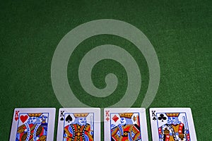 Full set of King Playing cards on green felt background