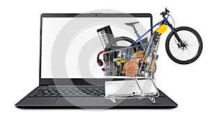 Full shop cart filled with many goods like bicycle music instruments elkectronics DSLR camera and pc computer hardware on notebook