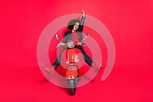 Full size of attractive overjoyed model raise hand shout scream bike trip journey isolated on red color background