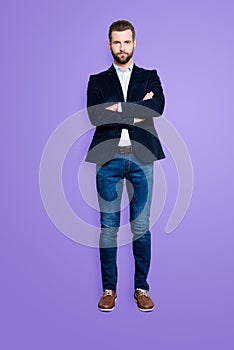 Full size body portrait of handsome virile teacher with stubble having his arms crossed looking at camera isolated on