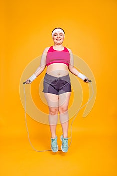 Full-size full-length photo of cheerful female obese athlete wit