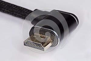 Full-size HDMI connector on used cable edge close-up