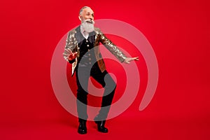 Full size photo of aged man happy positive smile have fun comic dance party  over red color background