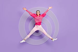 Full size photo of cheerful happy young woman jump up air star shape isolated on violet color background