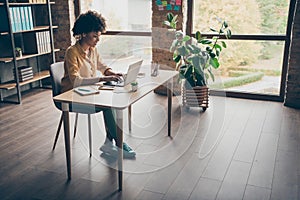 Full size photo of cool smart afro american girl real estate agent work computer type start-up presentation sit table in