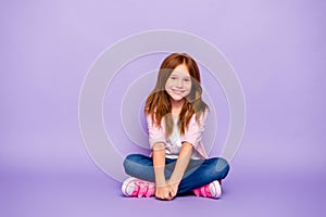 Full size photo of foxy little lady sitting floor friendly smiling wear casual clothes  purple background