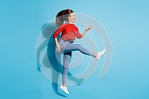 Full size photo of funky crazy lady jump flight play imaginary guitar musician  blue color background