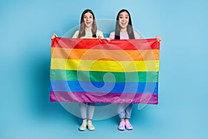 Full size photo of funny cheerful lesbians couple came foreign parade support tolerance same sex marriages hold gay