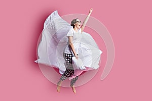 Full size photo of funny crazy lady jump high pillow between legs blanket flight moving ahead wear sleep mask white t