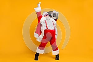 Full size photo of funny overweight christmas white beard hair grandfather hold retro boombox show v-signs have fun on x