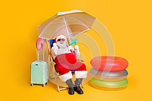 Full size photo of grey white hair bearded santa claus relax chill chaise-lounge x-mas christmas hold paper card plane