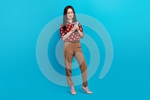 Full size photo of intelligent person wear red blouse brown trousers look at smartphone read email isolated on blue