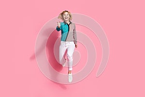 Full size photo of pretty young girl running hurry black friday wear trendy striped cyan outfit  on pink color