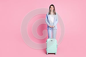 Full size photo of young beautiful dreamy smiling agent woman look copyspace hold baggage isolated on pink color
