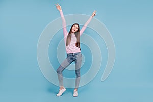 Full size photo of young cheerful girl happy positive smile show peace cool v-sign isolated over blue color background