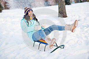Full size photo of young funky funny crazy screaming positive woman riding fast speed sledge having fun winter holiday