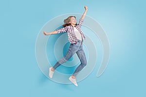 Full size photo of young happy cheerful smiling excited girl jumping look copyspace  on blue color background