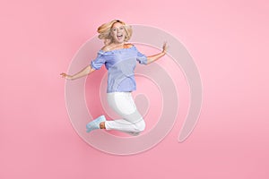 Full size photo of young happy pretty crazy screaming girl jumping in excitement  on pink color background