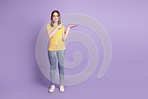 Full size photo of young pretty girl point finger product offer advert suggest isolated over purple color background