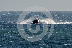 Full speed boat on rough sea