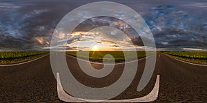 Full spherical seamless hdri panorama 360 degrees angle view on asphalt road among fields in summer evening sunset with awesome