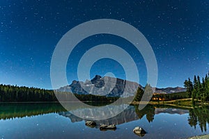 Full of stars above the Mount Rundle from Two Jack Lake at night in Banff National Park, Canadian Rockies