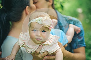 Full of tenderness. Family love to newborn. Newborn baby feels parents tenderness and protection. Love and tenderness