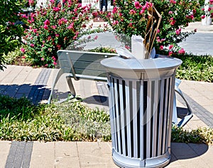 Full trash can in a city park