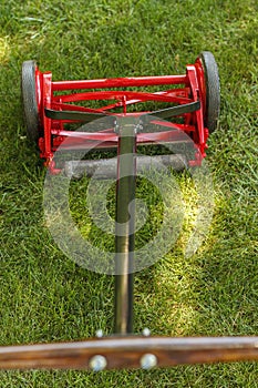 a full view of a reel lawnmower after the restoration process was completed