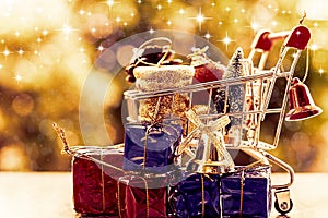 Full of Xmas decorative items in mini shopping cart or trolley