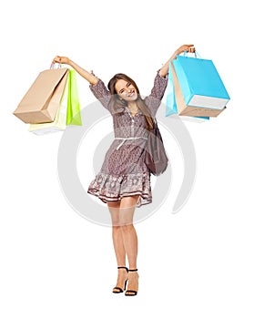 Fullbody portrait of beautiful woman with bags isolated on white