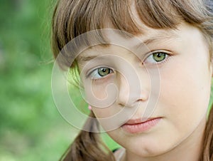 Fullface portrait of serious little girl