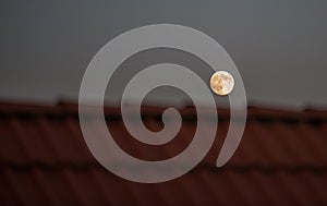 Fullmoon over roof photo