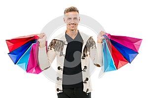 Fully excited man with heavy shopping bags. ready for holidays. male shopper isolated on white. beauty and fashion for