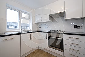 Fully fitted modern kitchen in white
