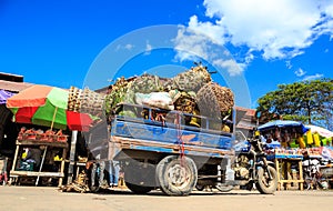 Fully loaded pickup motor with fruits on a market