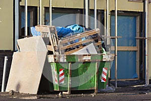 Fully loaded skip on a construction site