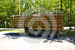 Fully loaded truck trailer with wooden pallets surrounded with wooden boards without Truck