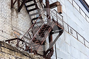 Fully rusty iron staircase in an abandoned old Soviet industrial