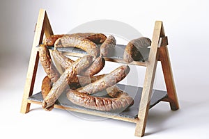 Fully-stocked snack stand, featuring an array of sausages on a rack