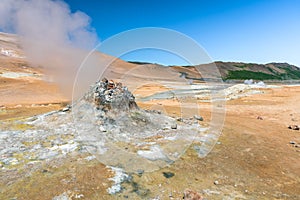 Fumarole in geothermal area in Iceland and blue sky