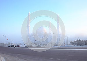 Fumed winter street around the mosque