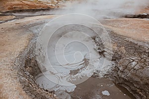 Fuming hot ground in the geothermal area Hverir, Iceland in summer. Myvatn region, North part of Iceland