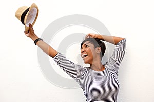 Fun african american girl cheering with arms raised