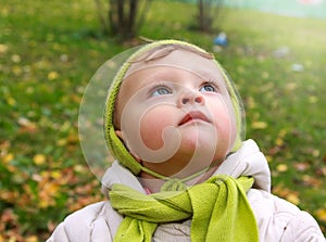 Fun baby looking up with serious